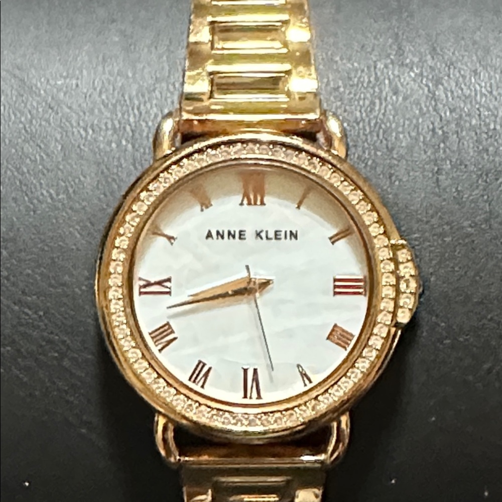 Anne Klein AK/3650 Gold Tone Mother of Pearl Dial Crystal Accented Bezel Watch